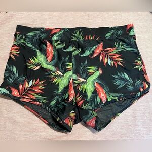 Torrid black tropical print dolphin hem swim shorts. Size 1X